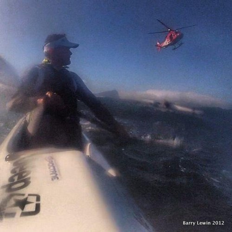 The AMS METRO Rescue Helicopter hovers overhead, directing the NSRI&#039;s Eddie Beaumont II rescue RIP to the scene.