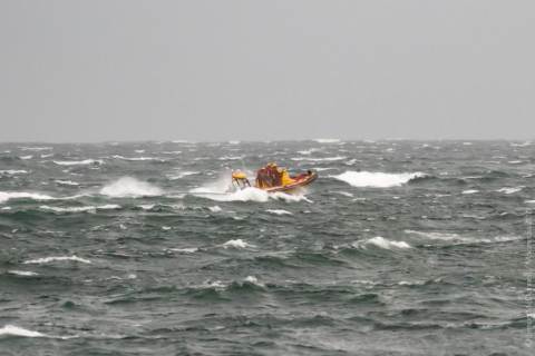The NSRI's "Spirit of Surfski II" RIB heads out to sea in 30kt of southeaster